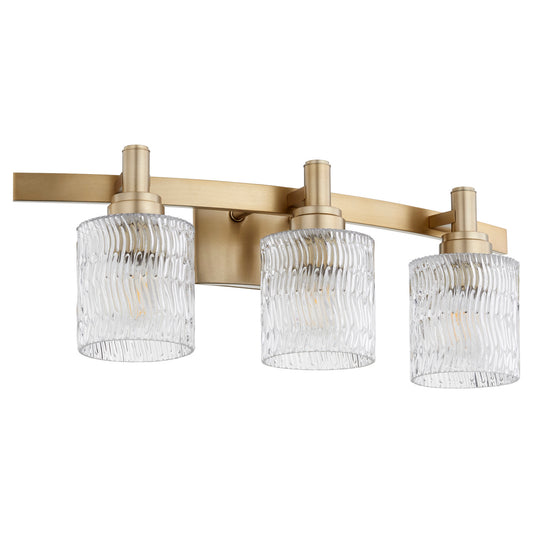  Stadium Three Light Vanity by Quorum in Aged Brass Finish (5184-3-80)